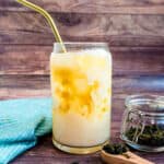 Homemade milk tea served in a cup with ice.