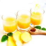 Ginger juice being served in shot glasses.