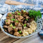 Pan seared garlic butter steak bites served over rice.