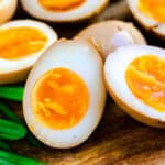 Ramen eggs cut in half showing cross sectional cut.
