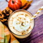 Starbucks copycat pumpkin Frappuccino served in a cup with whip cream and pumpkin spice sprinkled on top.