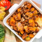 Baked maple glazed kabocha in bite size pieces served in baking dish.