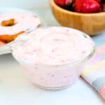 Homemade whipped strawberry cream cheese recipe served in a glass bowl.