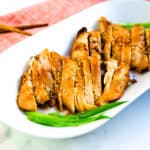 Baked marinated soy sauce chicken topped with green onion and toasted sesame seeds.