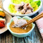 Sesame sauce being used as dipping sauce for Japanese shabu shabu hot pot.