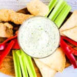 Cream Cheese Garlic Dip mixed with Japanese furikake served in a bowl with pork rinds, chips and vegetables.
