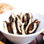 Oven baked shiitake mushrooms in a bowl, side shot.