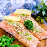 Baked Salmon with Parmesan Crust served with steamed green vegetables.