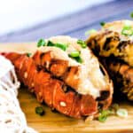 BBQ lobster tails with miso mayo garlic with green onions.