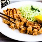 Japanese chicken katsu served on a bed of cabbage.