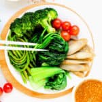 Steamed vegetables served with sesame sauce.
