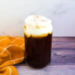 Cream cheese foam coffee in a serving glass.
