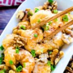 Honey walnut shrimp served on a plate with a pair of chopsticks