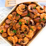 Close up shot of Cajun style copycat boiling crab shrimp boil served on a plate.