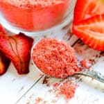 Homemade strawberry baking powder in a spoon.