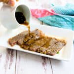 Japanese sweet steak sauce being poured onto a steak.