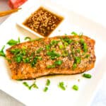 At home hibachi salmon served with ginger sauce.