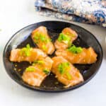 Yuzu ponzu salmon served on a plate.