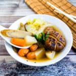 Japanese vegetable soup served in a bowl topped with mitsuba.