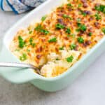 Seafood rice bake being scooped out with a fork.