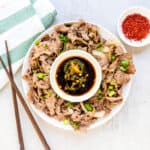 Spicy korean brisket chadol served on a plate.