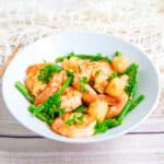 Stir fry scallops and shrimp served on a plate.