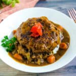 Japanese style hamburger curry served on a plate with rice.