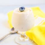 Silken tofu banana pudding served in a cup topped with sliced banana.