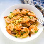 Japanese style shrimp pasta served on a plate.
