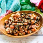 Teriyaki spam rice bowl topped with shredded seaweed.