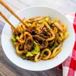 Yaki udon being picked up with a chopstick.