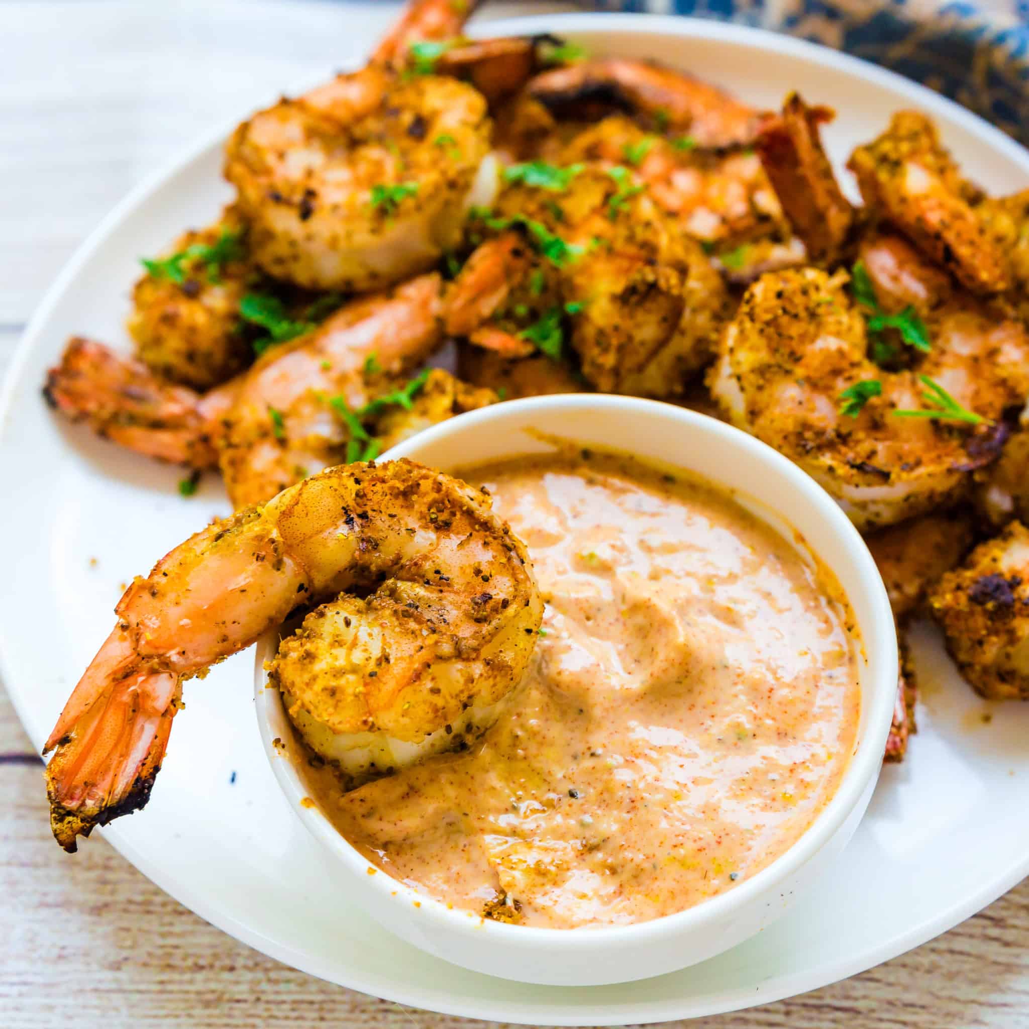 Grilled shrimps are dipped in seafood aioli.