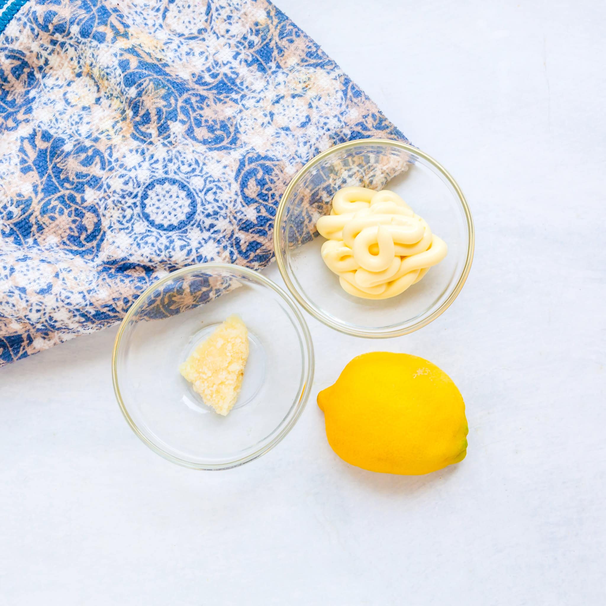Make the ingredients for lemon garlic aioli on the countertop. 
