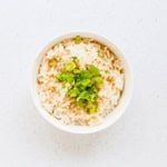 Bowl of rice served with drizzled with Japanese rice sauce.