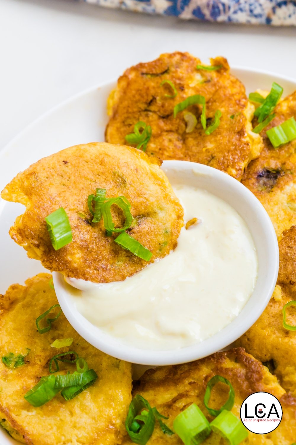 The crab cake is dipped in lemon garlic aioli.