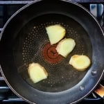 Japanese sake and dashi being cooked in a frying pan.