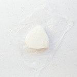 Rice ball in a saran wrap.