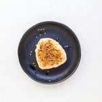 Soy garlic rice ball served on a plate.