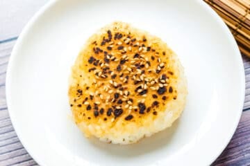 Miso yaki onigiri rice balls served on a plate.