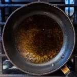 Yakitori sauce in a frying pan.