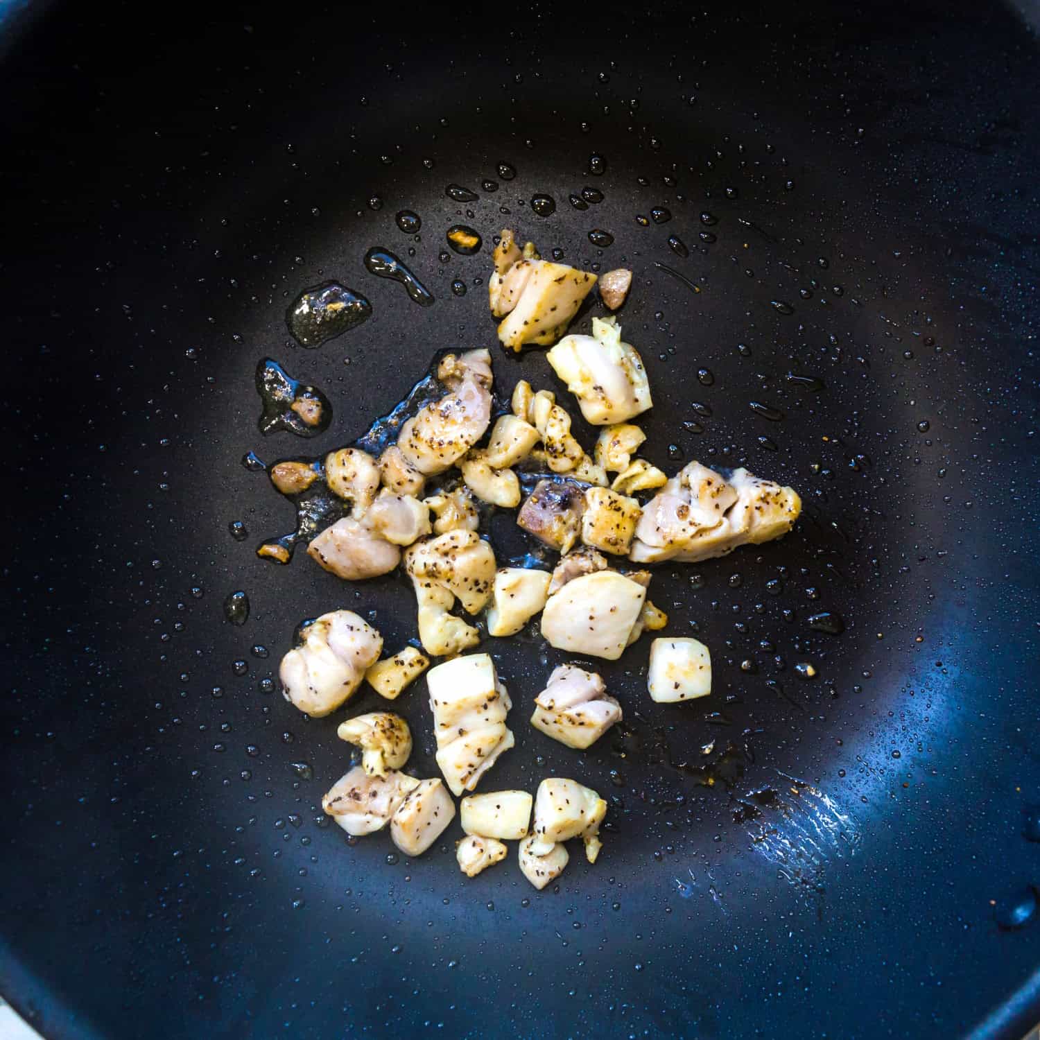 Cut the chicken into pieces and cook in a pot.