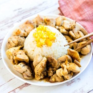 The pepper lunch chicken was picked up with a pair of chopsticks.