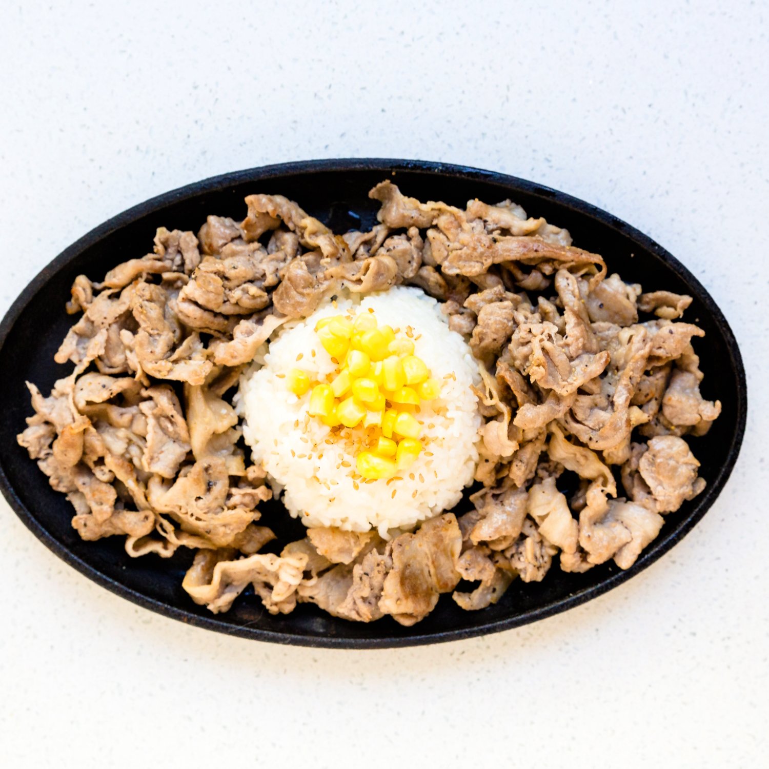 Pepper lunch pork rice on a plate. 