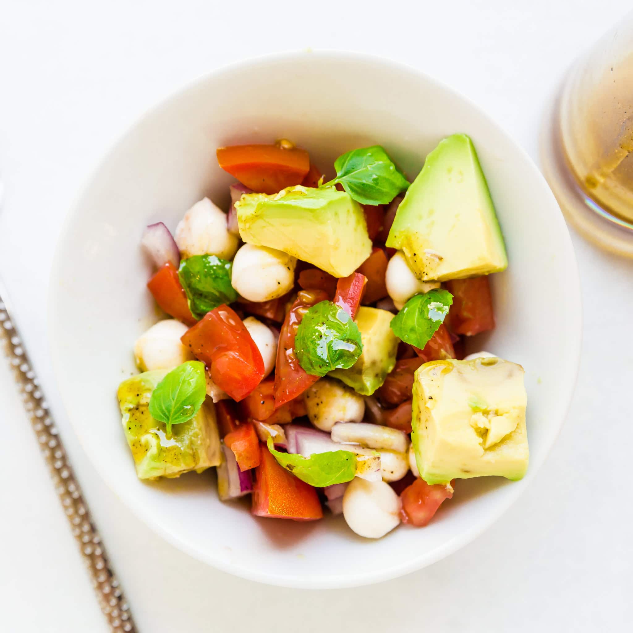 Avocado Mozzarella Salad served in a bowl.